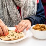 closeup-woman-hand-taking-food-260nw-1642109653