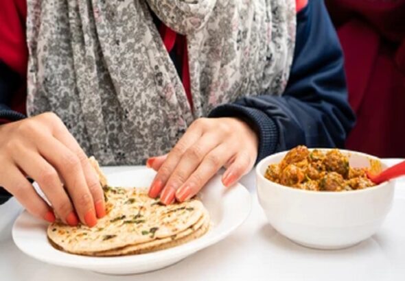 closeup-woman-hand-taking-food-260nw-1642109653