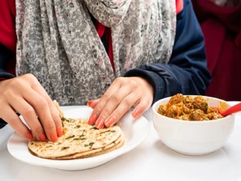 closeup-woman-hand-taking-food-260nw-1642109653